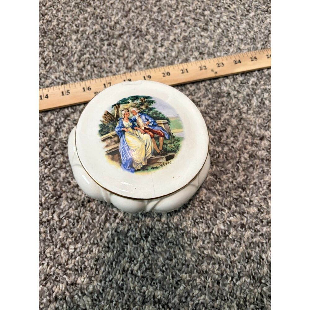 Vtg. Round Porcelain Trinket box with romantic couple scene